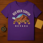 Purple t-shirt featuring a desert landscape within a tortoise silhouette.
