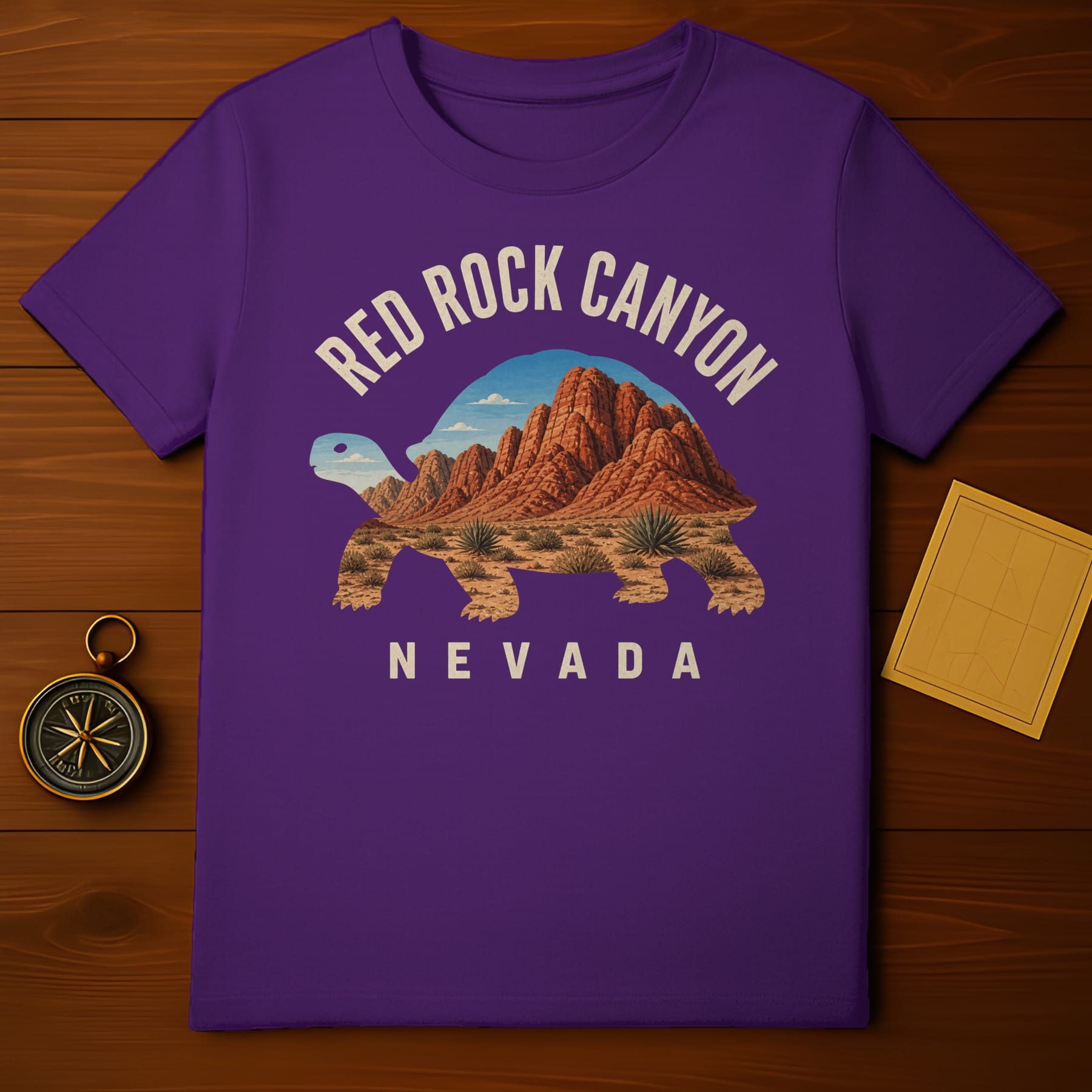 Purple t-shirt featuring a desert landscape within a tortoise silhouette.