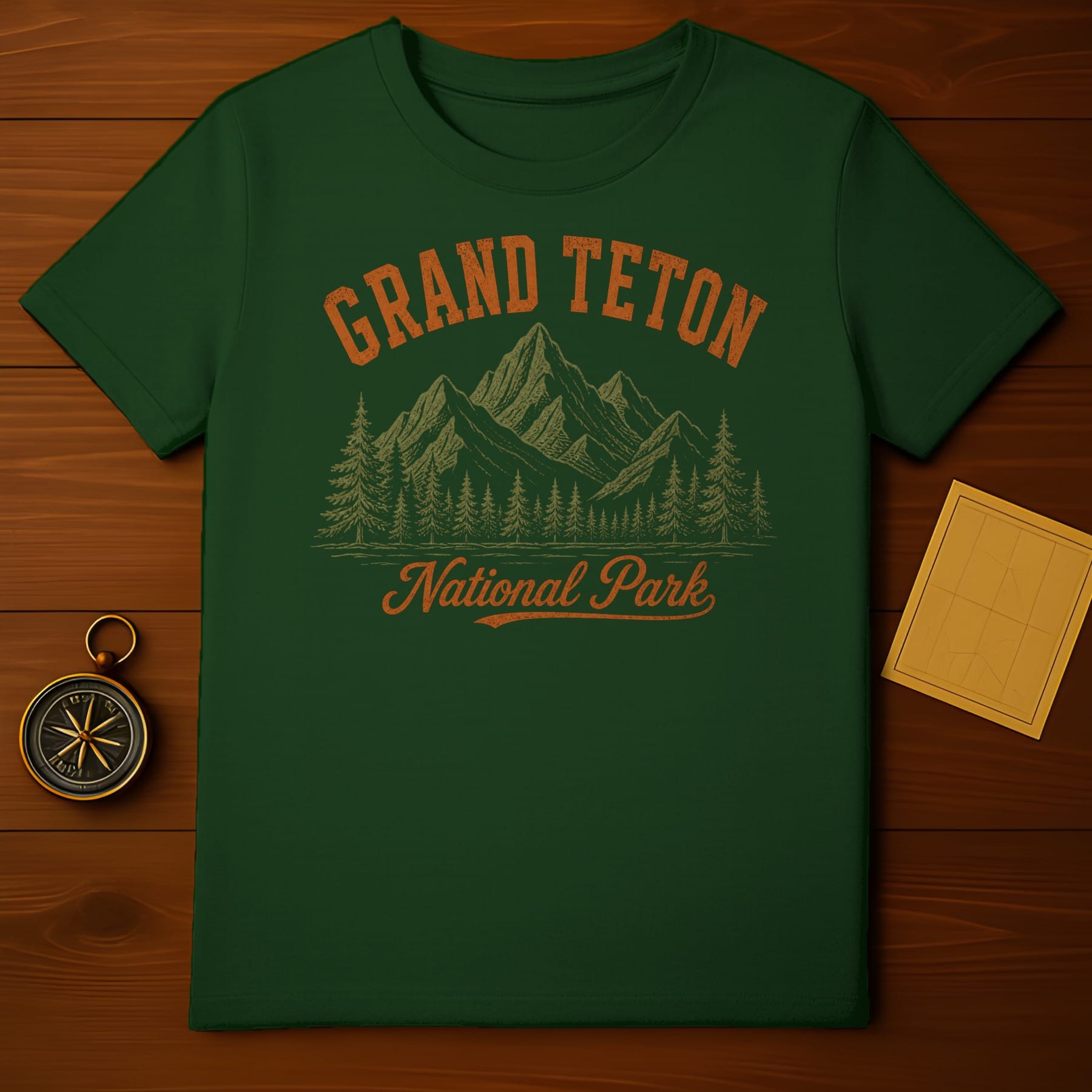 Green t-shirt with Grand Teton National Park graphic.