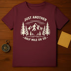 JUST ANOTHER HALF MILE OR SO Mountains Trees product type
Hiking
Adventure
Mountains
Trees
Nature
Outdoors
T-Shirt
Graphic Tee
Travel
Explore
Burgundy Shirt
Maroon Shirt
Pine Trees
Trail
Wanderlust
Forest
Camping
Scenic
Journey
Outdoorsy