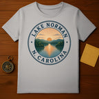 Grey t-shirt with circular Lake Norman, N.C. sunset graphic.
