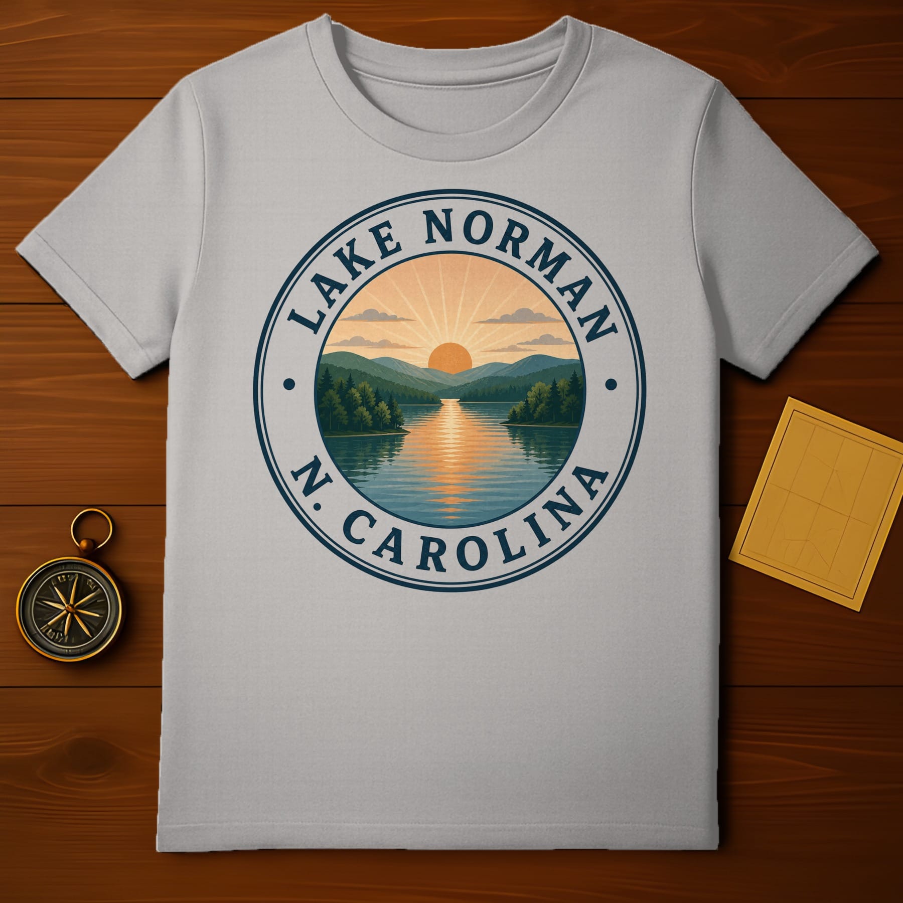 Grey t-shirt with circular Lake Norman, N.C. sunset graphic.