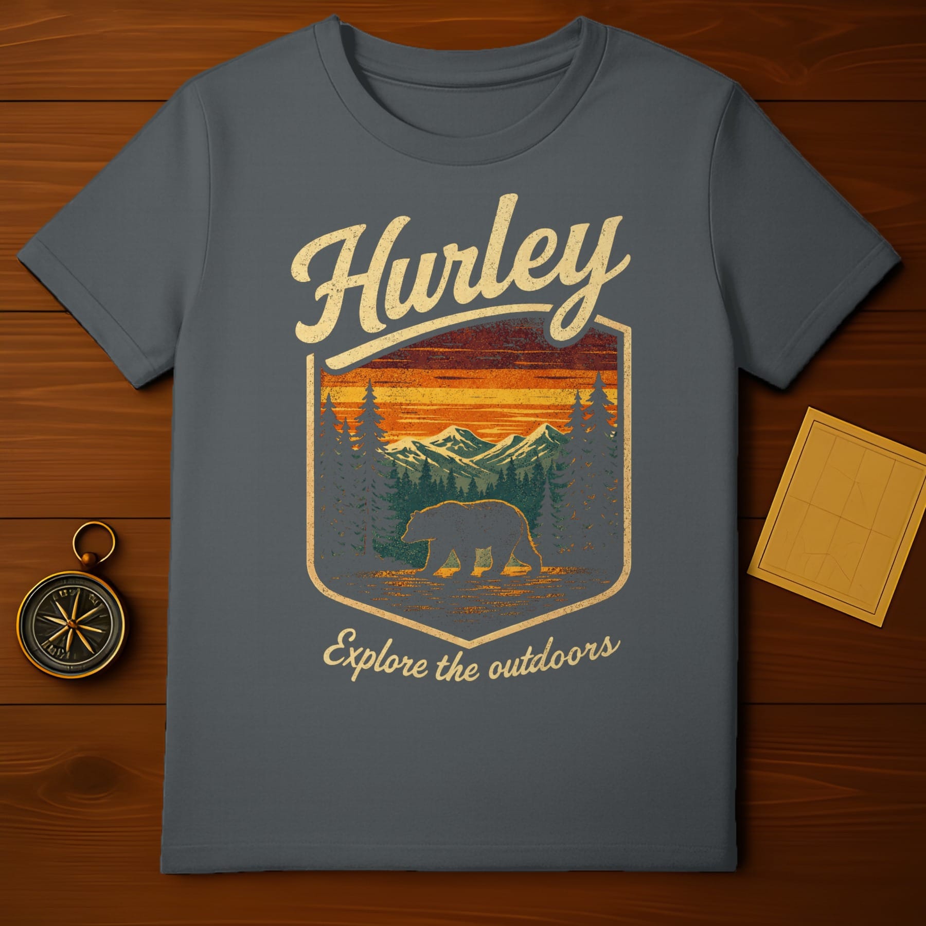 Grey Hurley t-shirt with a vintage graphic of a bear in a forest landscape.