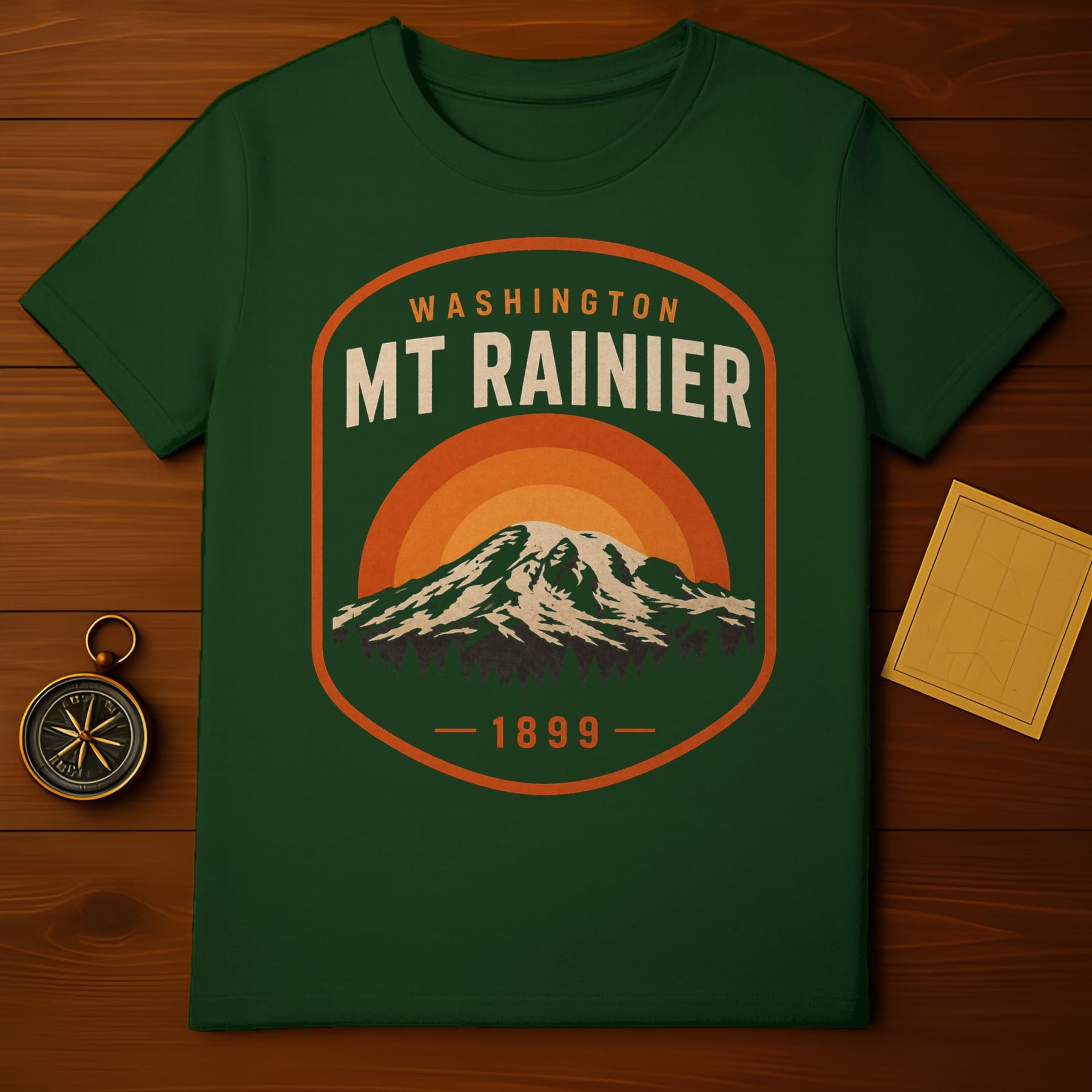 Green t-shirt with Mt. Rainier sunset graphic and "Washington 1899" text.