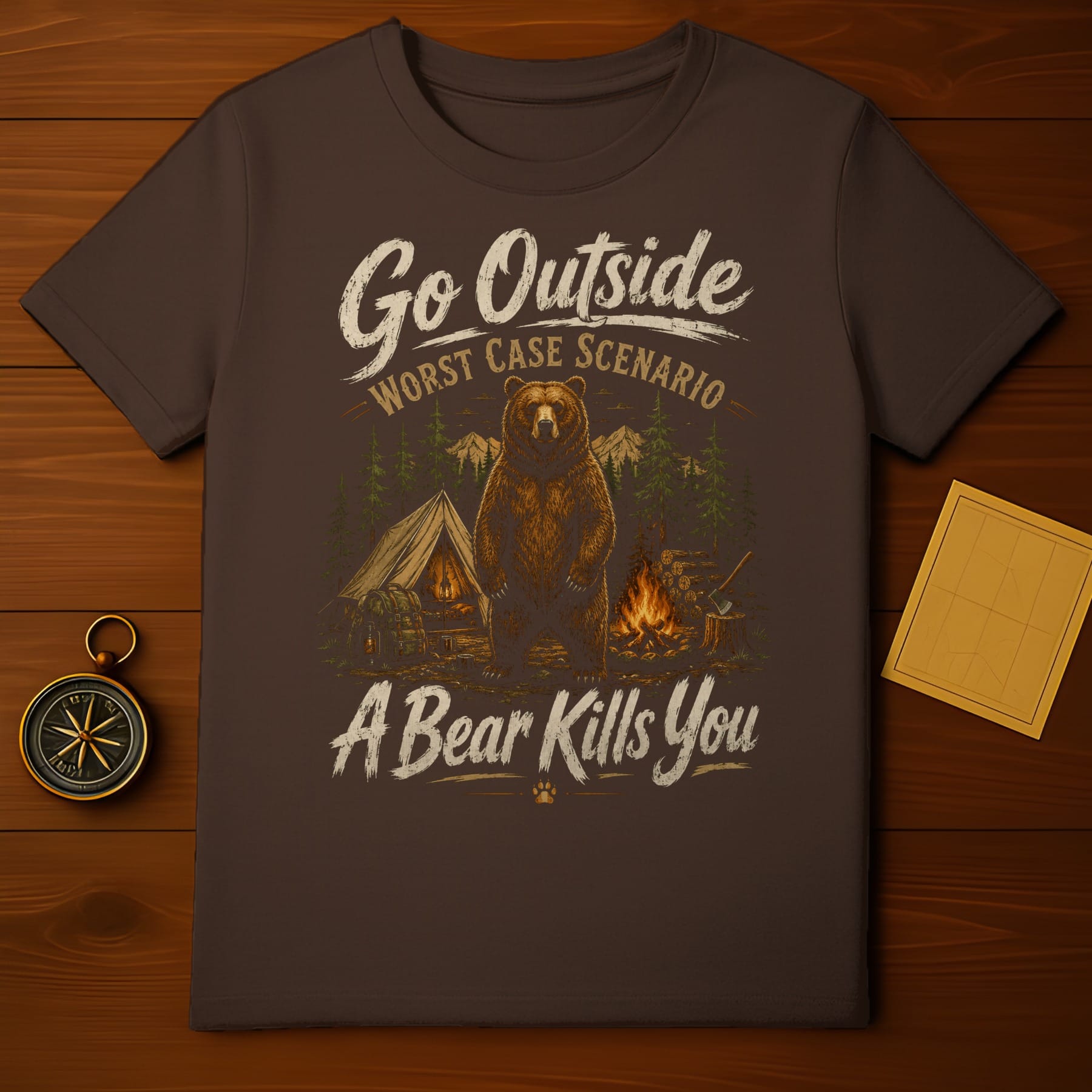 Brown t-shirt with bear, tent, campfire, and text "Go Outside A Bear Kills You".