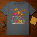 Grandma Camp 2026 graphic with tent, sun, campfire, and peace symbol.