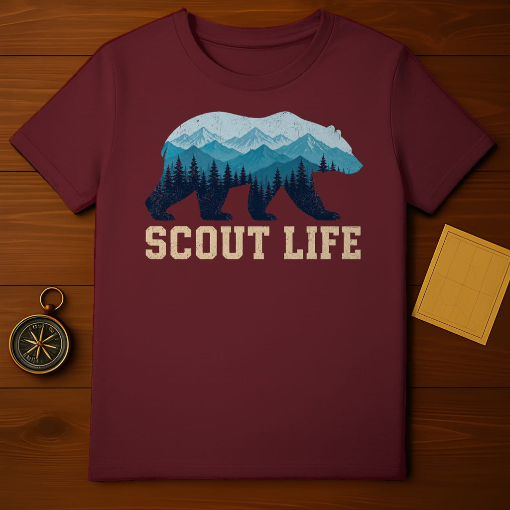 Maroon t-shirt with a bear silhouette filled with mountains, forests, and text "SCOUT LIFE".