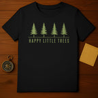 Black t-shirt with green pine trees and text "HAPPY LITTLE TREES".