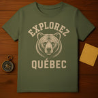 Green t-shirt with bear graphic and "Explorez Québec" text.