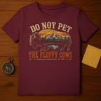 Maroon t-shirt with graphic "Do Not Pet The Fluffy Cows Yellowstone National Park - Est. 1872".