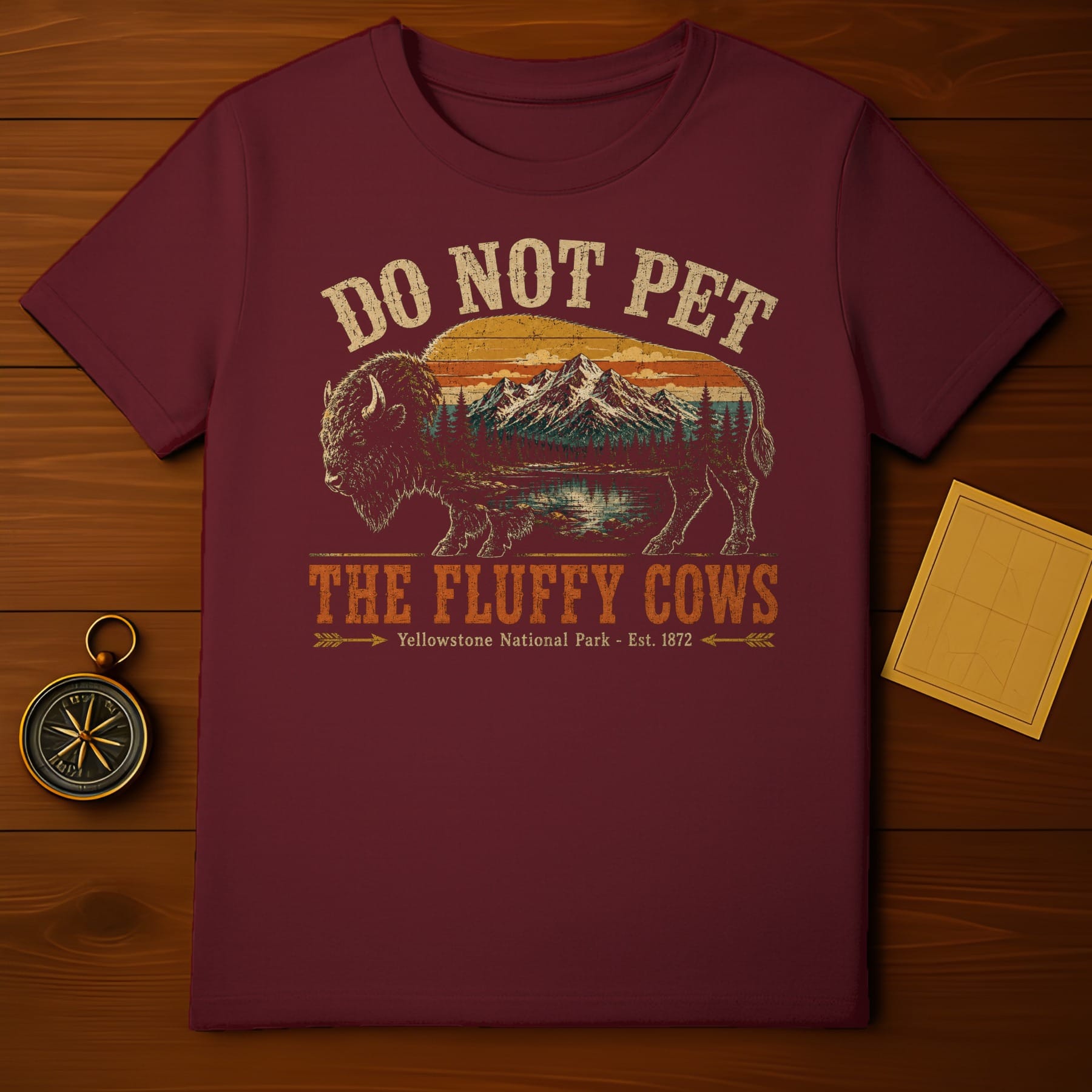 Maroon t-shirt with graphic "Do Not Pet The Fluffy Cows Yellowstone National Park - Est. 1872".