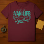 Maroon t-shirt with "Vintage Van Life Live Free" text and laurel wreath graphic.