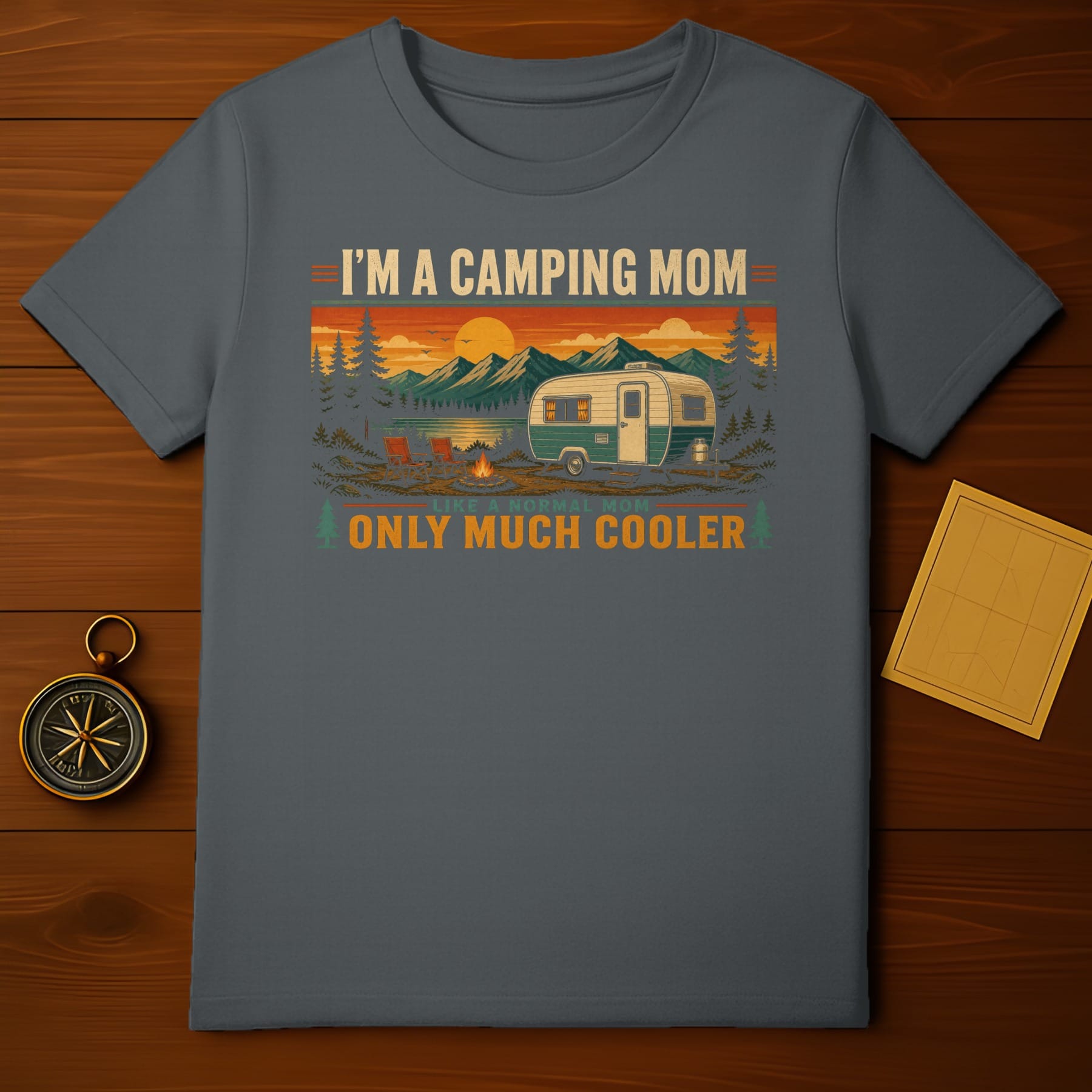 I'm a camping mom only much cooler text on charcoal t-shirt with camper and sunset scene.