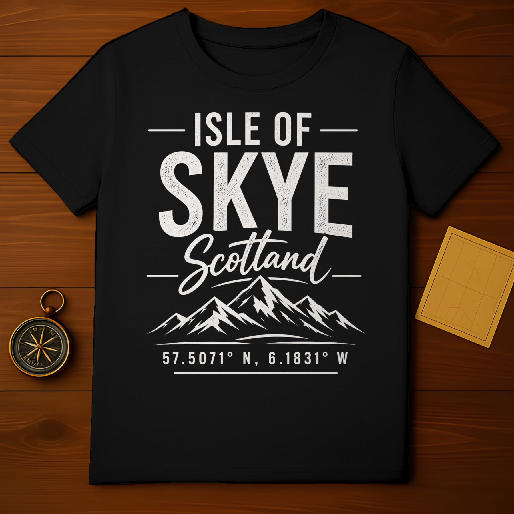 Black t-shirt with "Isle of Skye Scotland" text and mountain graphic.