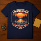 Navy t-shirt featuring a vintage Minnesota landscape design with two ducks on a lake.