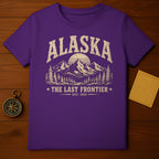 Purple t-shirt with distressed "Alaska The Last Frontier Est. 1959" graphic.