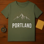 Green t-shirt with "PORTLAND OREGON" text and mountain graphic.