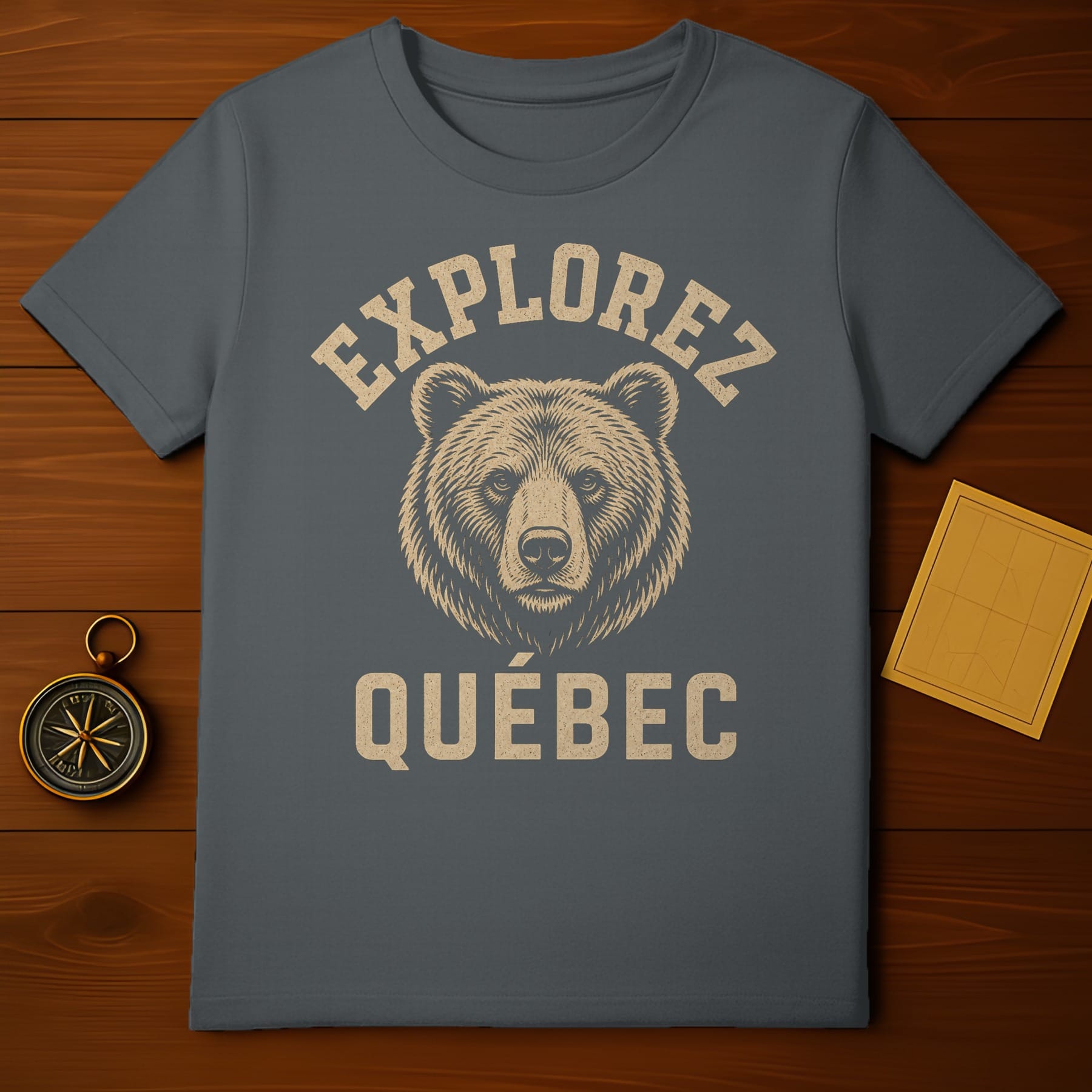 T-shirt with "Explorez Quebec" text and a bear illustration.