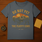 Dark gray t-shirt with a sunset scene and "Do Not Pet the Fluffy Cows" text.
