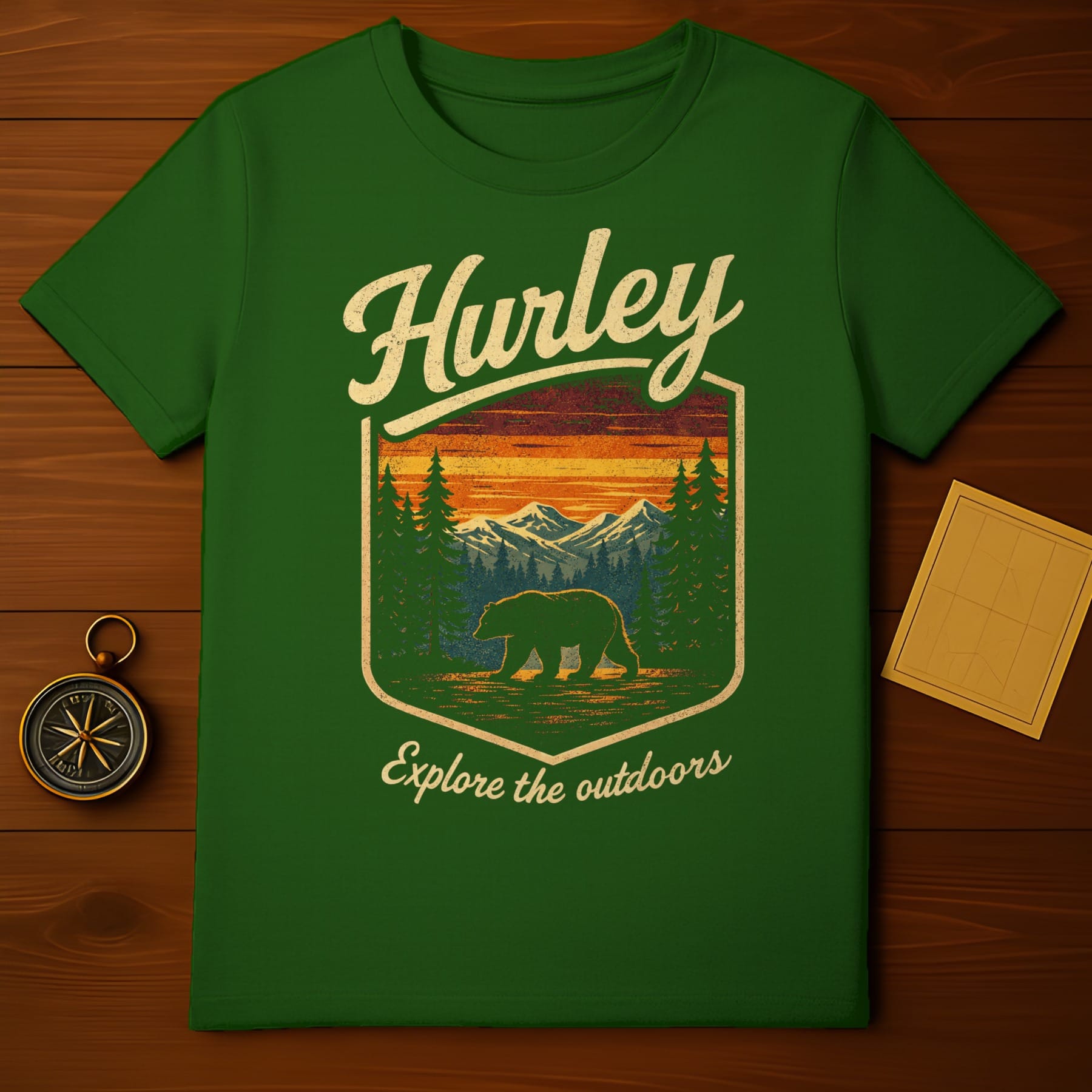 Green t-shirt with "Hurley Explore the outdoors" and a bear in a forest scene.