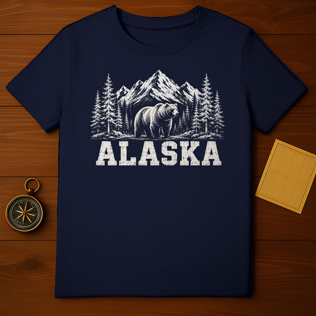 Navy t-shirt with distressed grizzly bear, pine trees, and mountains graphic with "ALASKA" text.