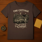 Brown t-shirt with a rustic cabin scene and "The Cottage Est. 2017" text.