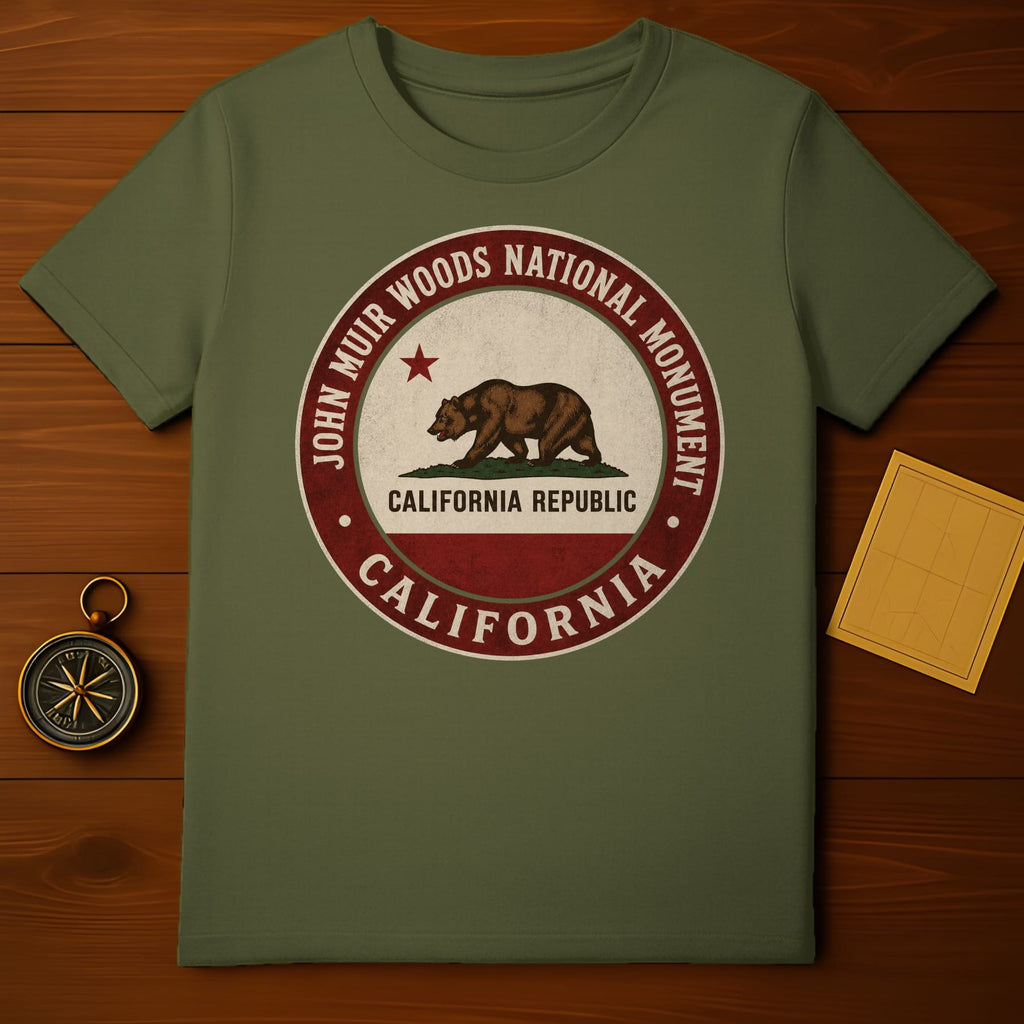 Olive green t-shirt with John Muir Woods National Monument California circular logo.