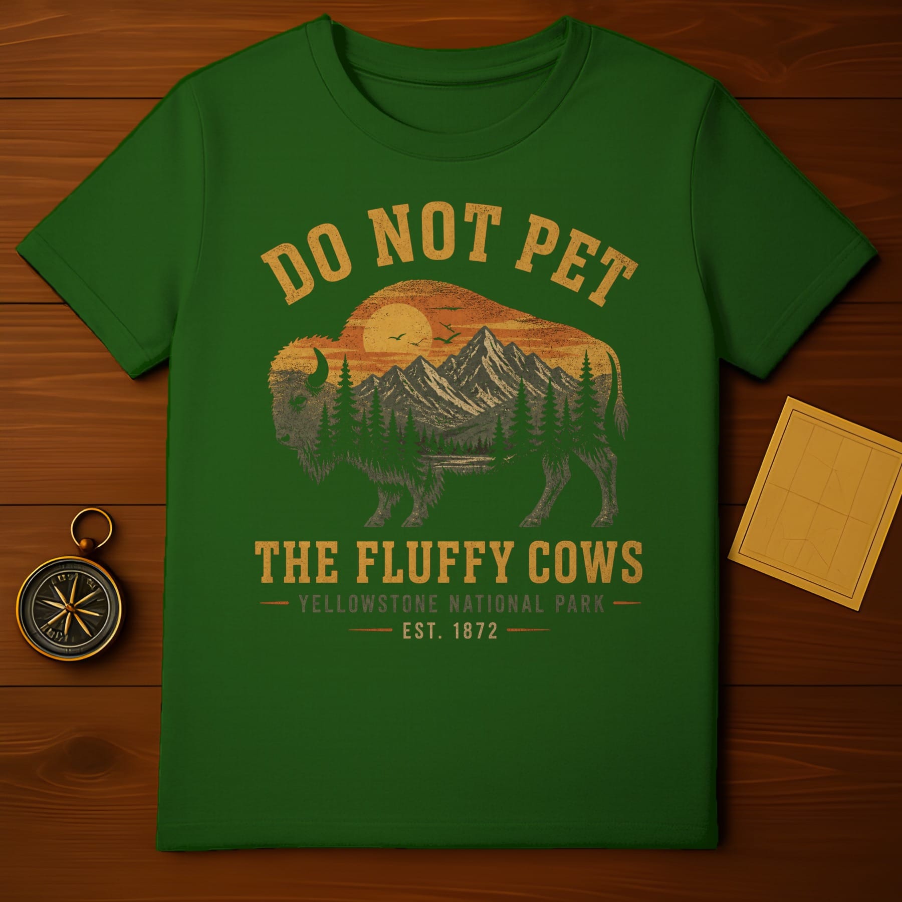 Green t-shirt with "Do Not Pet The Fluffy Cows" Yellowstone National Park graphic.