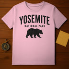 Pink t-shirt with black Yosemite National Park bear graphic.
