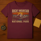 Maroon t-shirt with vintage Rocky Mountain National Park mountain and sun graphic.