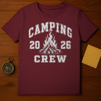 Maroon t-shirt with distressed white text "CAMPING 20 26 CREW" and campfire graphic.