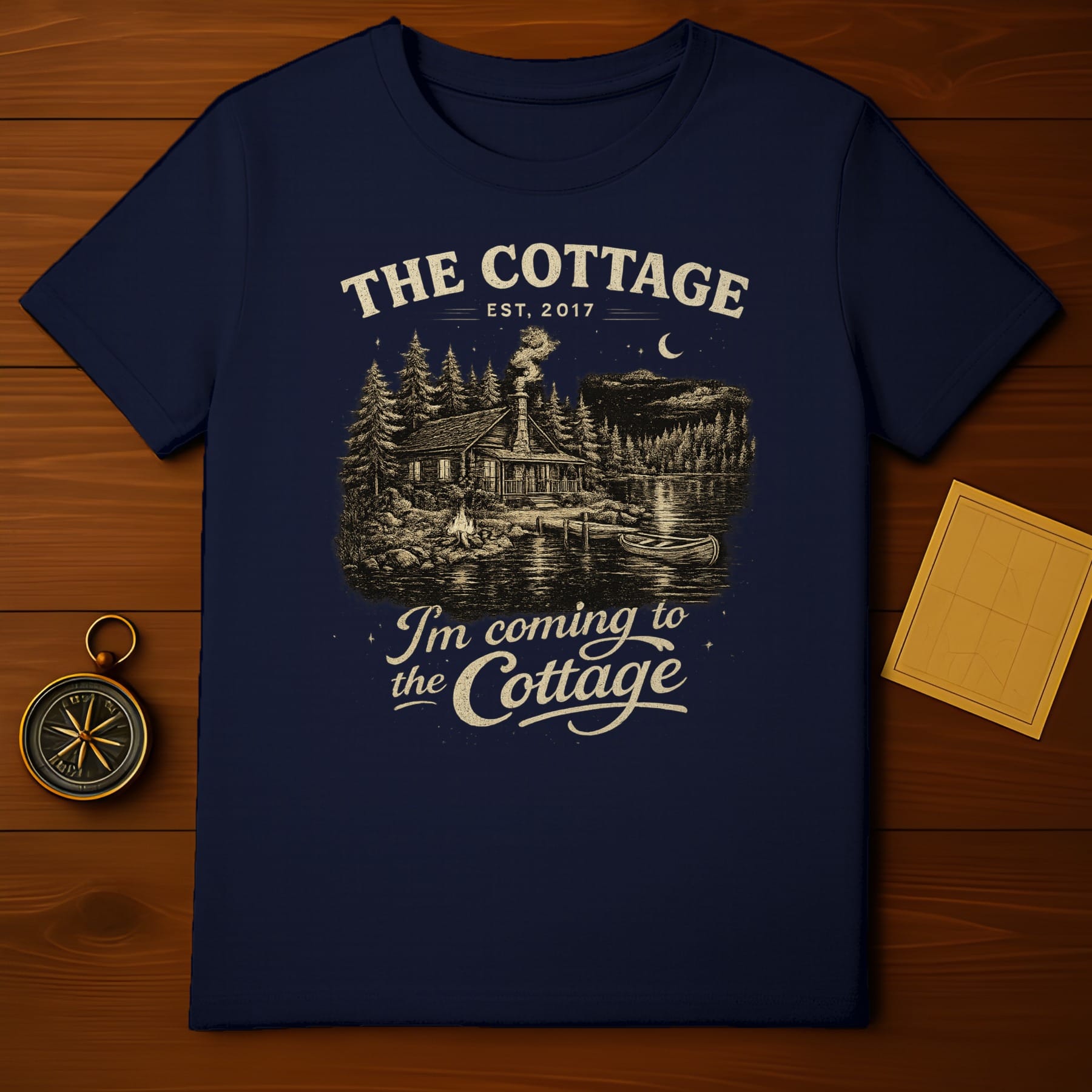 Navy t-shirt with "The Cottage EST. 2017 I'm coming to the Cottage" design.