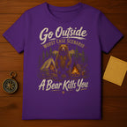 Purple t-shirt with "Go Outside Worst Case Scenario A Bear Kills You" text and bear illustration.