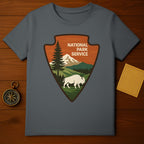 National Park Service Arrowhead Design T-Shirt product type
National Park Service, Arrowhead logo, Bison graphic, Mountains design, Pine tree art, Forest scenery, Nature inspired, Outdoor adventure, Wilderness travel, Camping apparel, Hiking shirt, Vintage style, Retro print, National parks, Buffalo art, Park theme, Gray t-shirt, Scenic landscape, Heritage design, Exploration gift