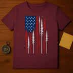 Maroon t-shirt with distressed American flag motif and pine trees.