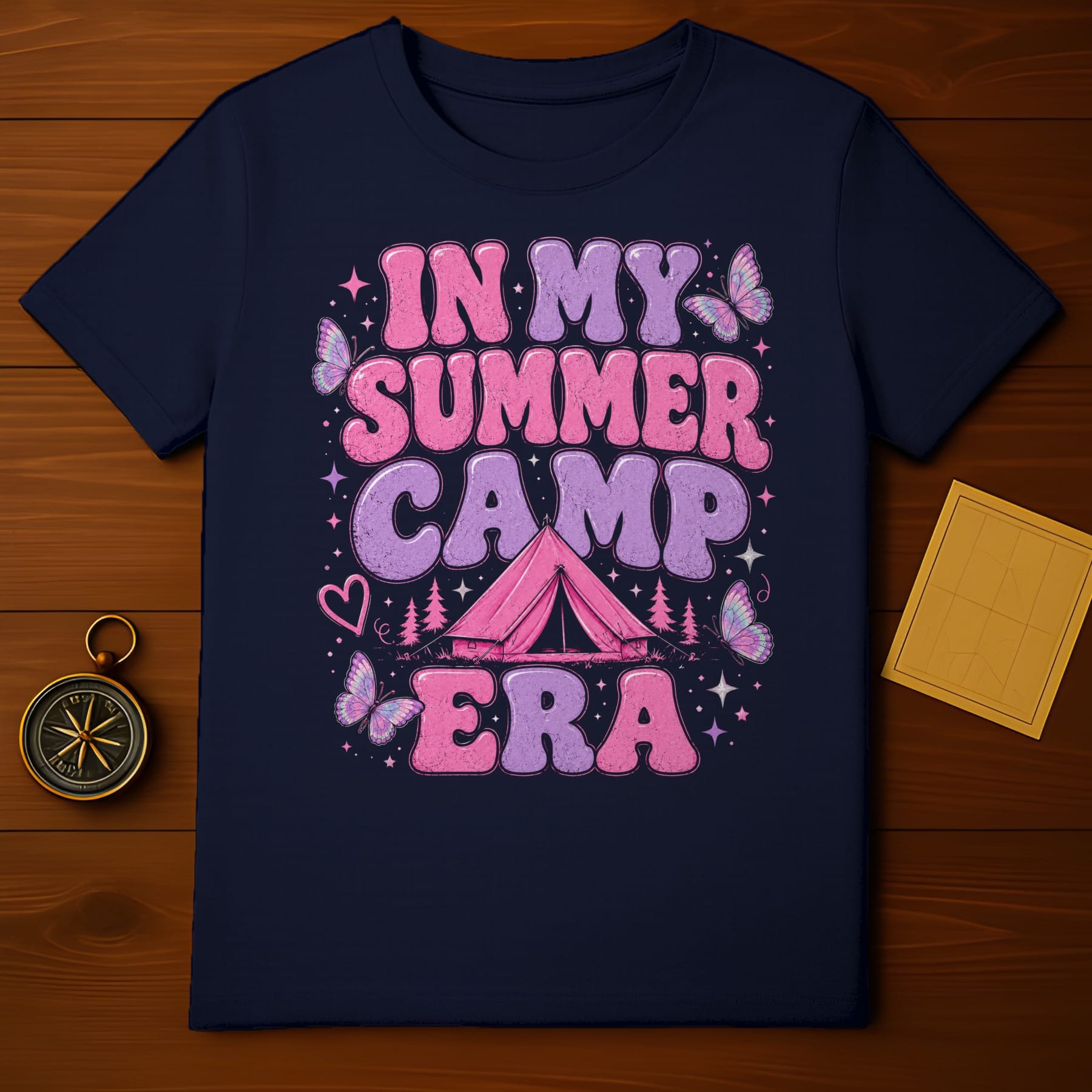 Dark navy t-shirt with "In My Summer Camp Era" text, tent, and butterflies.
