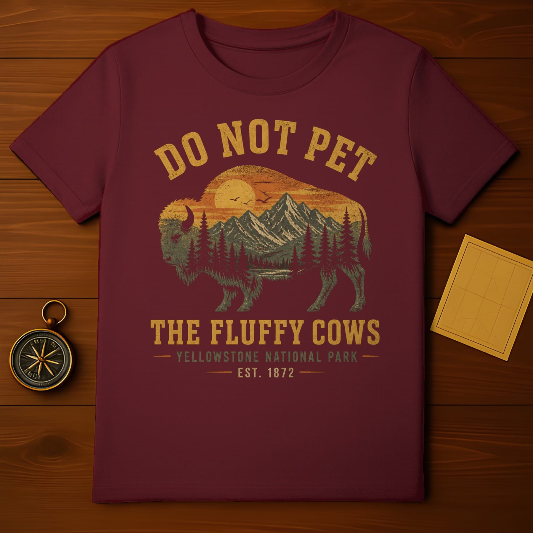Maroon t-shirt with a bison and mountain scene, reads "Do Not Pet".