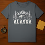T-shirt with distressed graphics of a bear, mountains, trees, and the word "ALASKA".