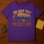 Purple t-shirt with "DO NOT PET THE FLUFFY COWS" and Yellowstone graphic.