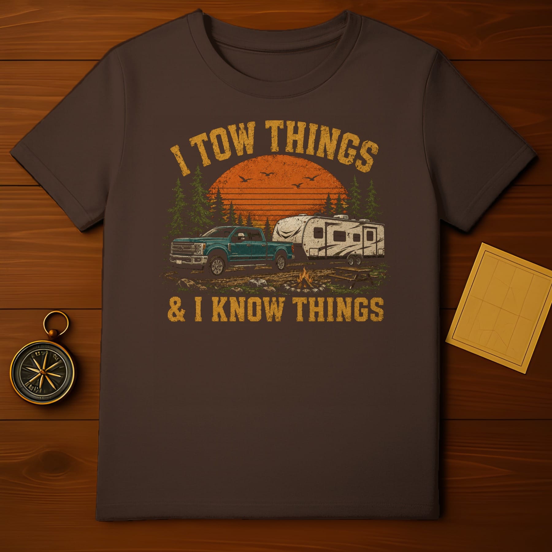 Brown t-shirt with "I tow things & I know things" graphic.