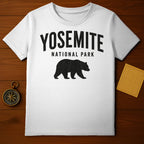 White t-shirt with black "Yosemite National Park" text and bear silhouette.