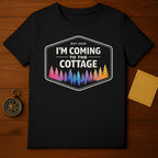 Black t-shirt with "EST 2025 I'M COMING TO THE COTTAGE" and colorful trees.