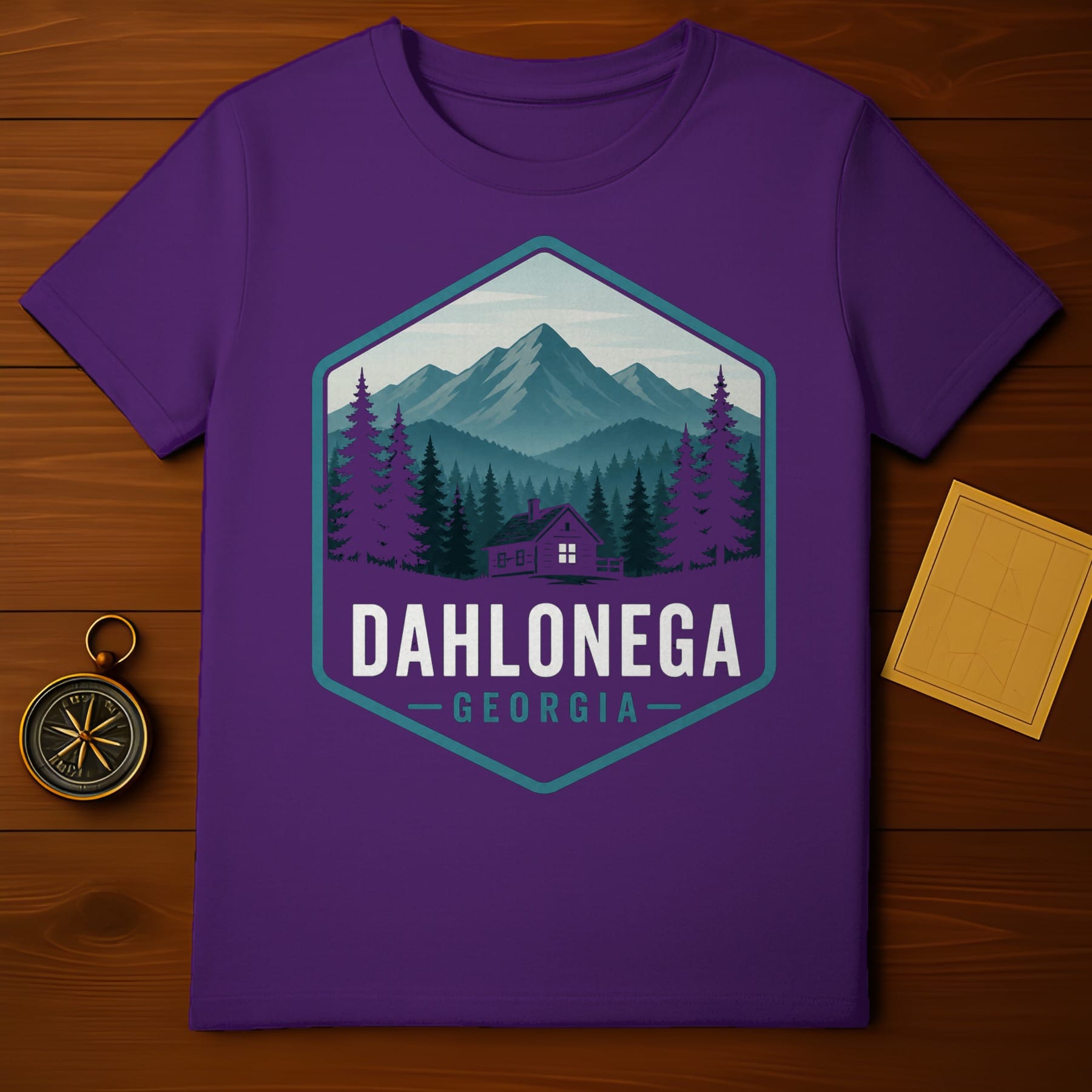 Purple t-shirt with Dahlonega, Georgia mountain and cabin graphic.