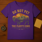 Purple t-shirt with "Do Not Pet The Fluffy Cows" Yellowstone National Park design.