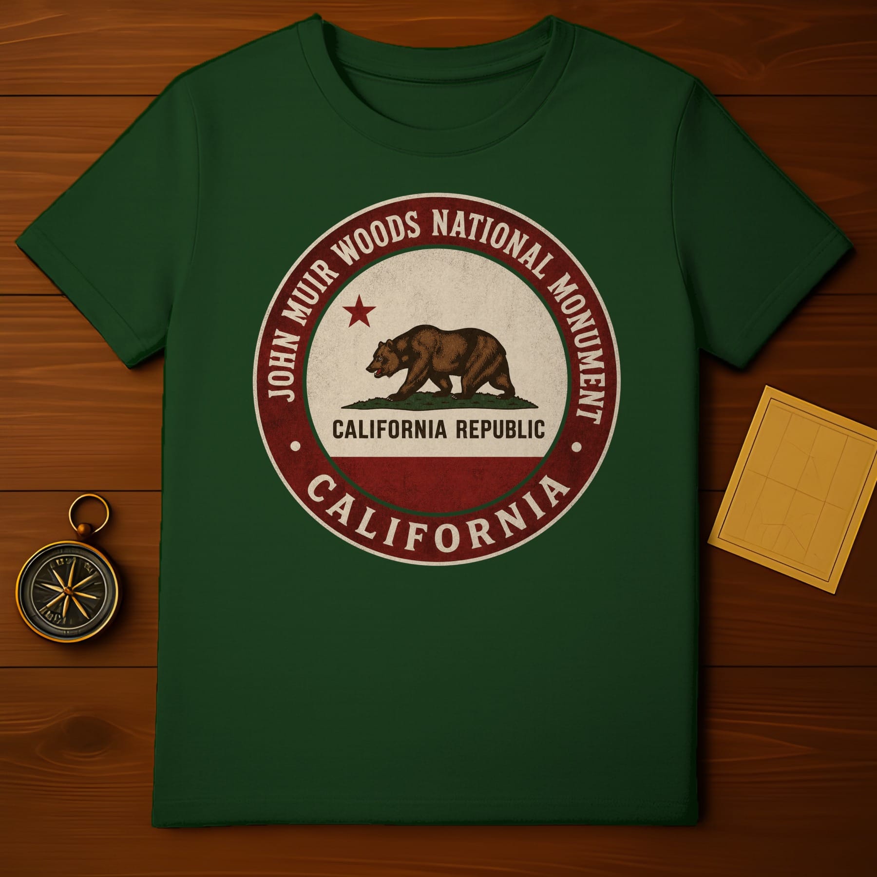 Green t-shirt with John Muir Woods California Republic circular emblem.