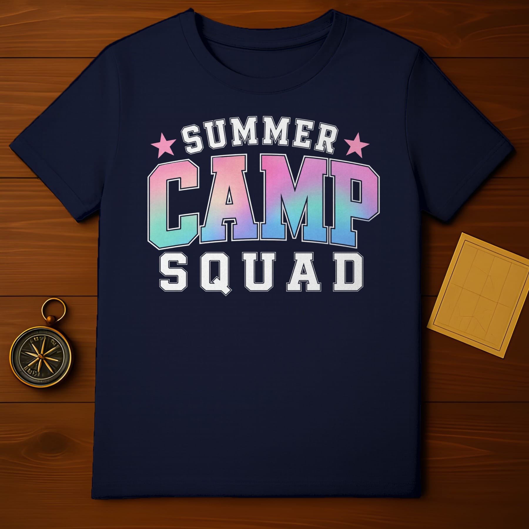 Dark t-shirt with "SUMMER CAMP SQUAD" text in colorful ombre and white block letters.