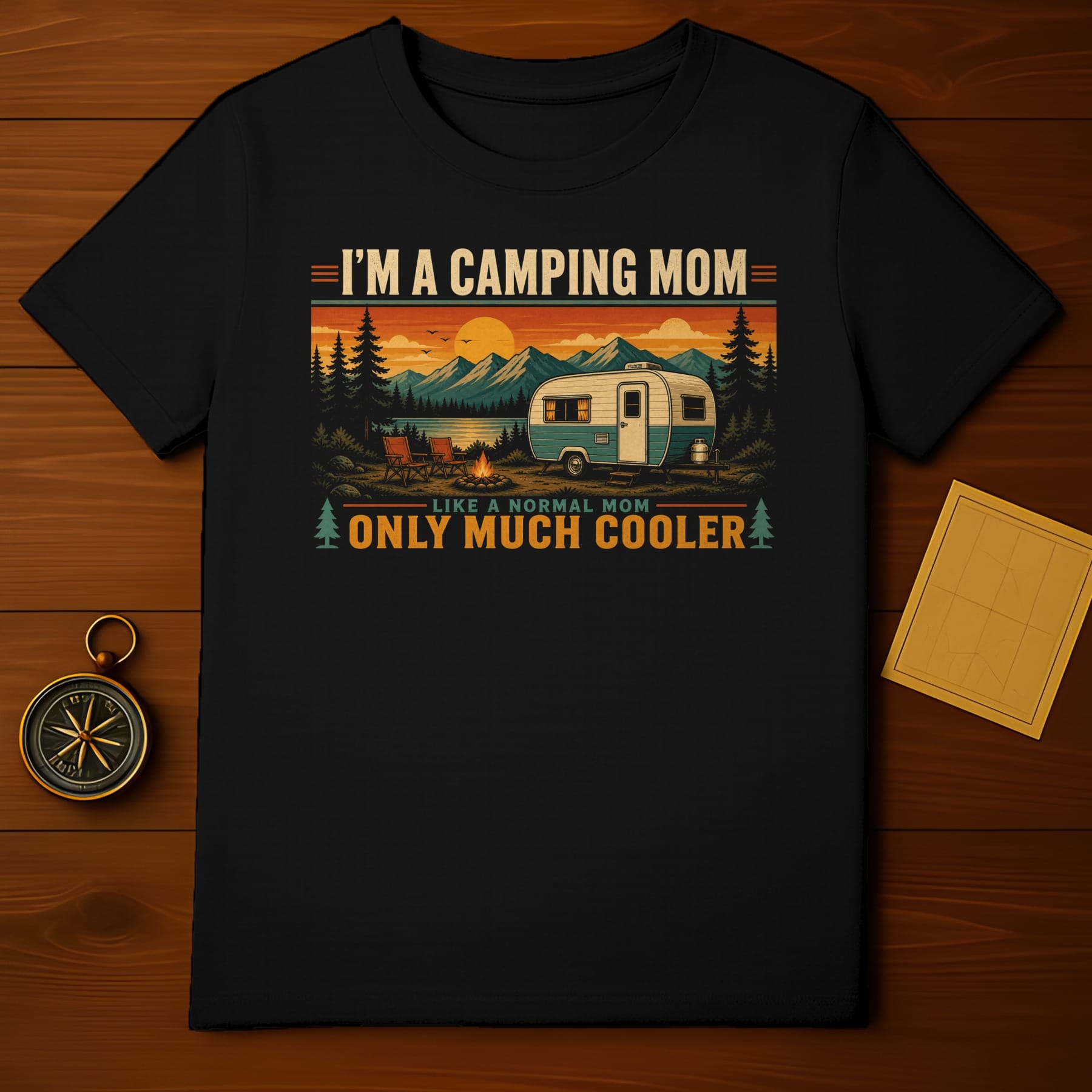 Black t-shirt with "I'm a camping mom like a normal mom only much cooler" graphic.