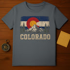 T-shirt featuring the Colorado state flag design with mountains and trees.