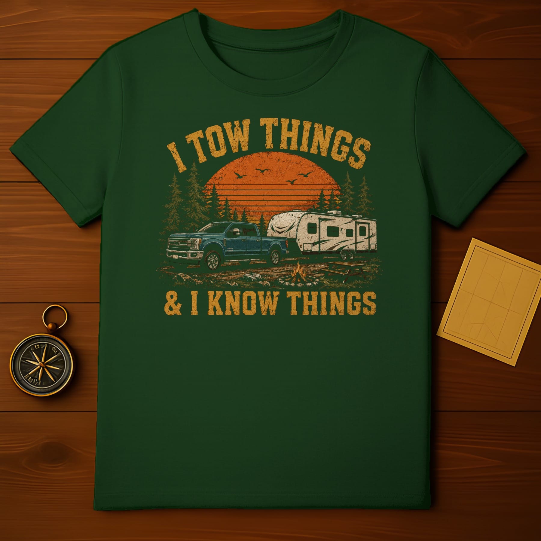Green t-shirt with "I TOW THINGS & I KNOW THINGS" text and camping graphic.