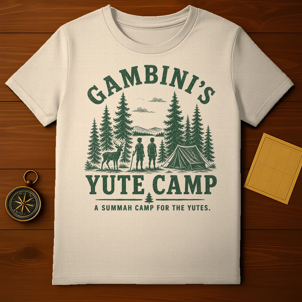 T-shirt with "Gambini's Yute Camp" text and forest scene.